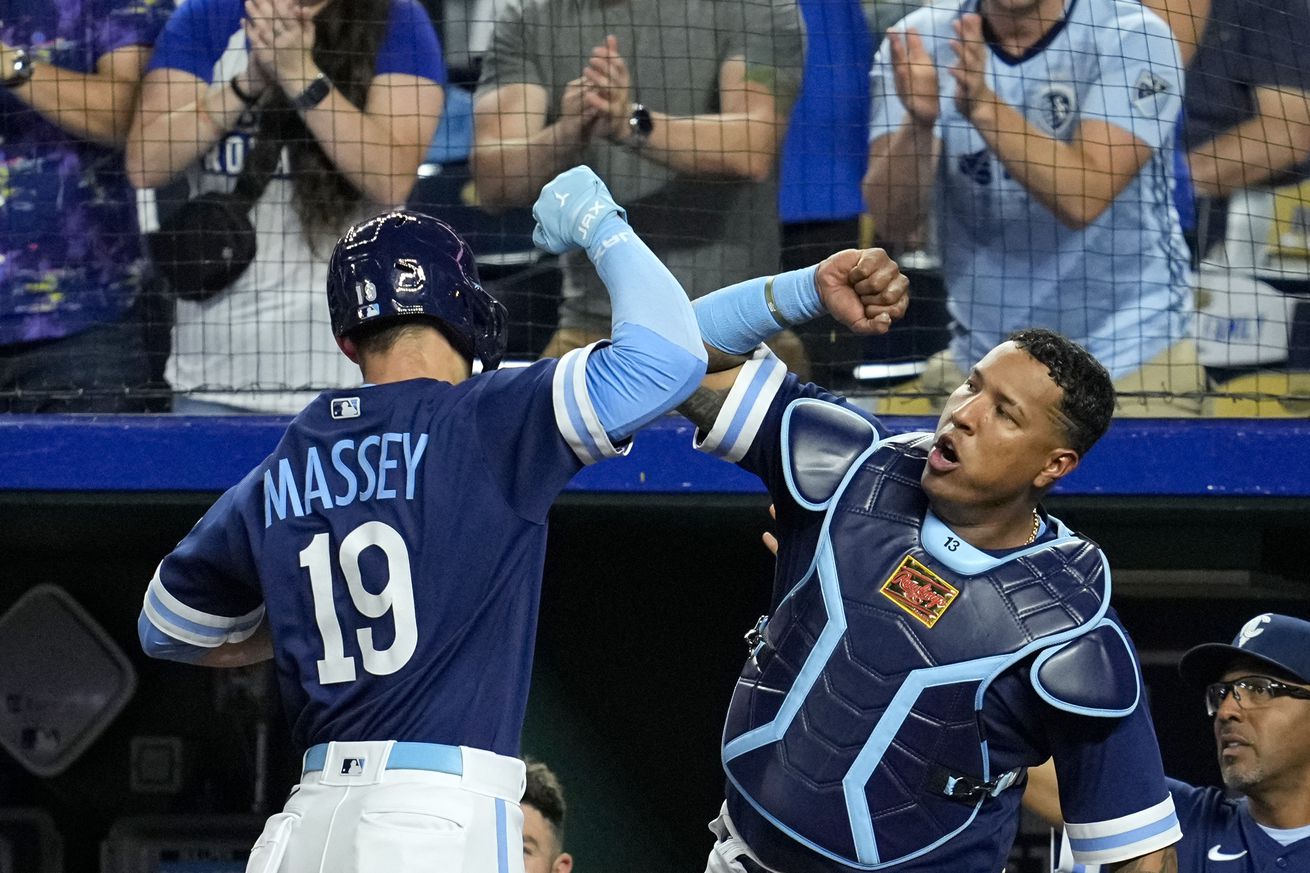 Kansas City Royals second baseman Michael Massey (19) celebrates with catcher Salvador Perez (21) after hitting a home run during the eighth inning against the Houston Astros at Kauffman Stadium. Mandatory Credit: Jay Biggerstaff