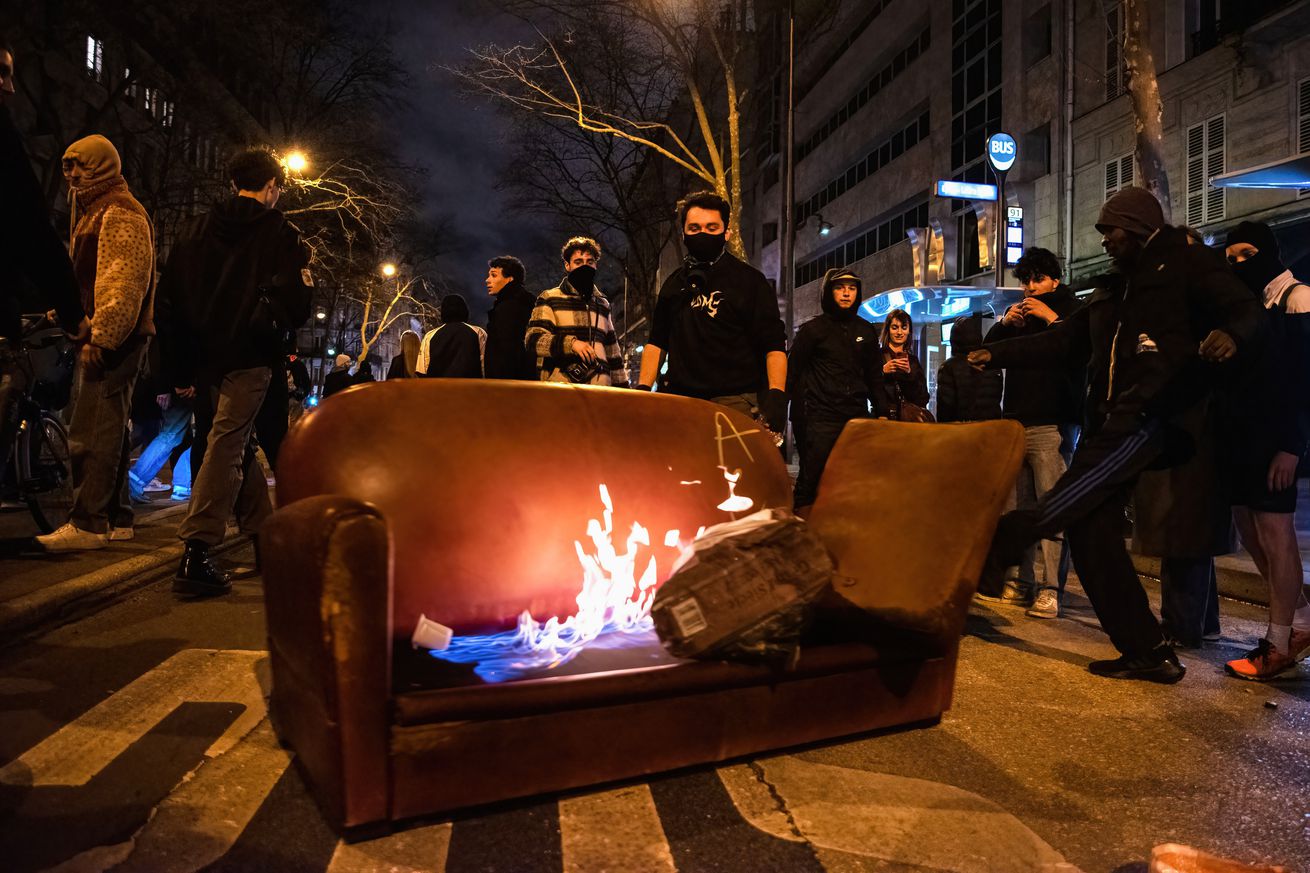 Protesters set a sofa on fire during the demonstration...