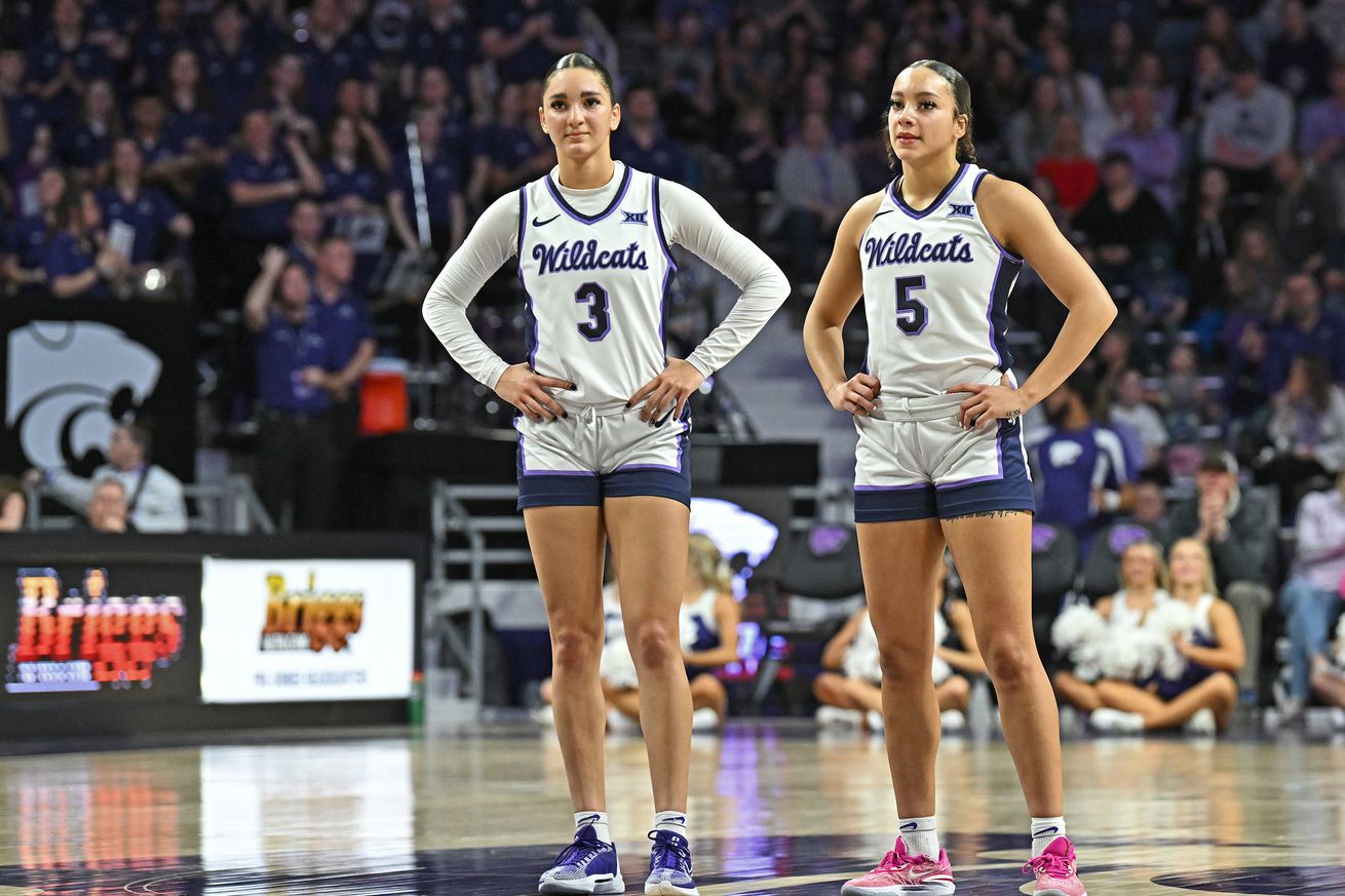 Jaelyn Glenn #3 and Brylee Glenn #5 of the Kansas State Wildcats look on during a stop in play in the second half of a game against the BYU Cougars at Bramlage Coliseum on January 27, 2024 in Manhattan, Kansas.