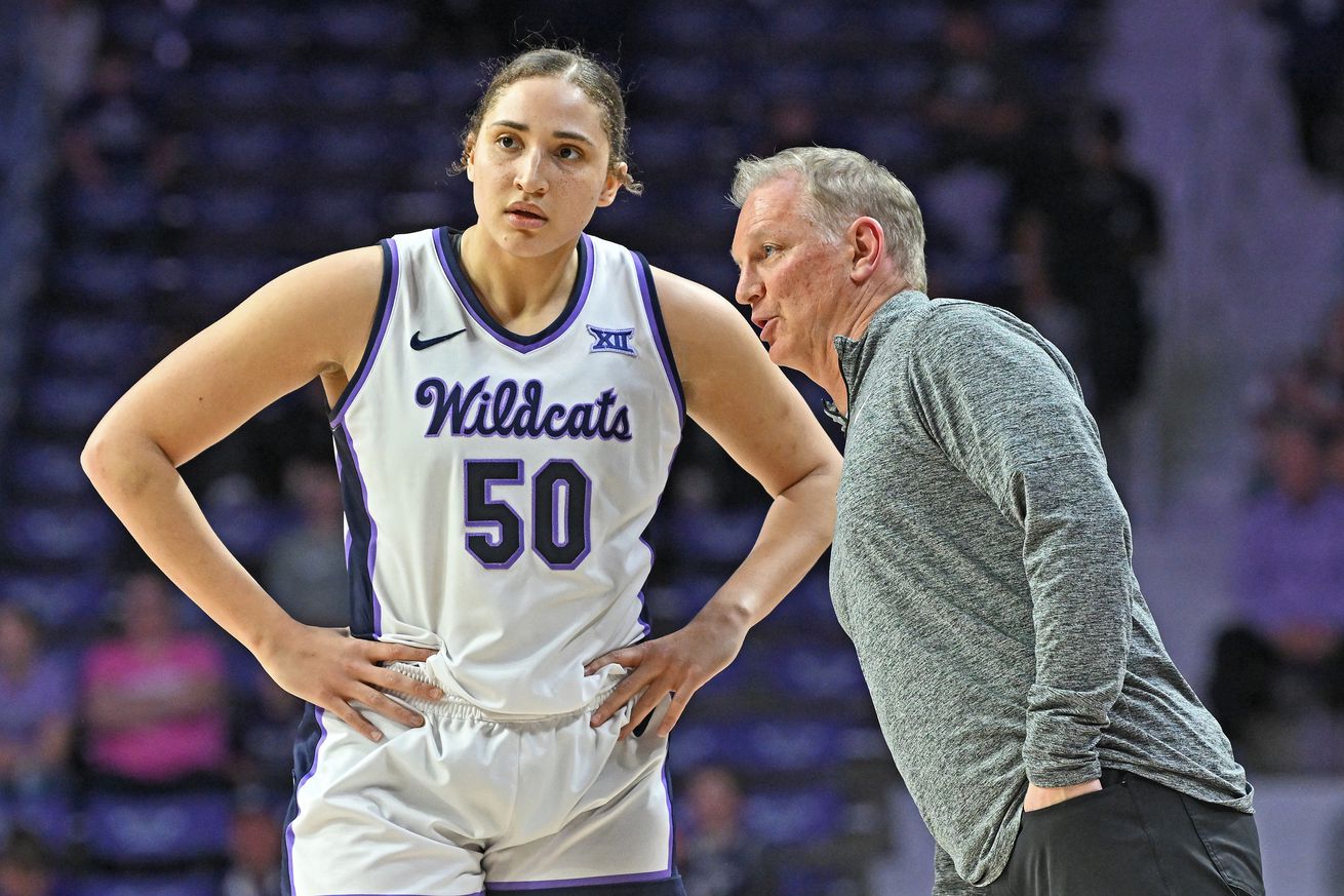 Head coach Jeff Mittie (R) of the Kansas State Wildcats instructs Ayoka Lee #50 in the second half of a game against the Iowa State Cyclones at Bramlage Coliseum on February 28, 2024 in Manhattan, Kansas.
