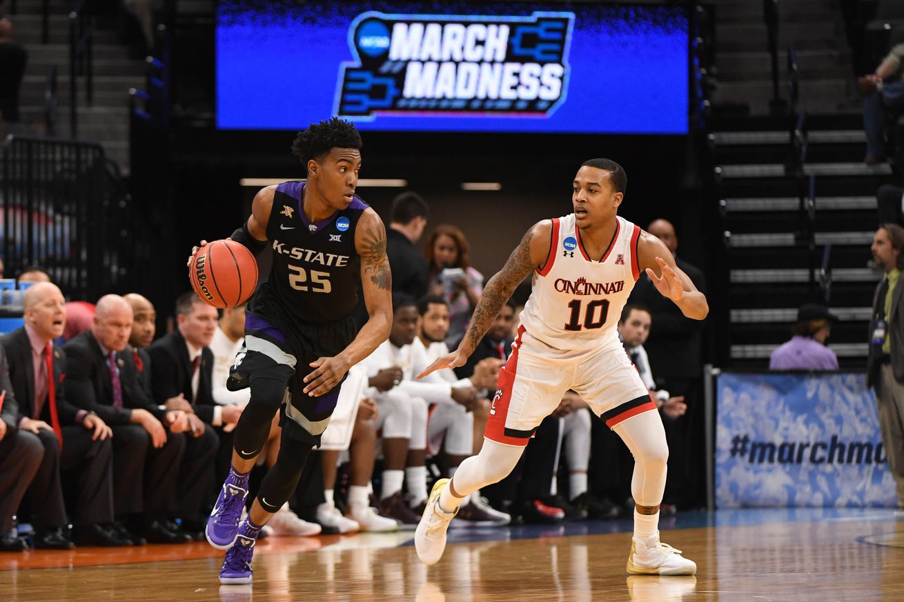 March 17, 2017; Sacramento, CA, USA; Kansas State Wildcats forward Wesley Iwundu (25) dribbles the basketball against Cincinnati Bearcats guard Troy Caupain (10) during the first half in the first round of the 2017 NCAA Tournament at Golden 1 Center.