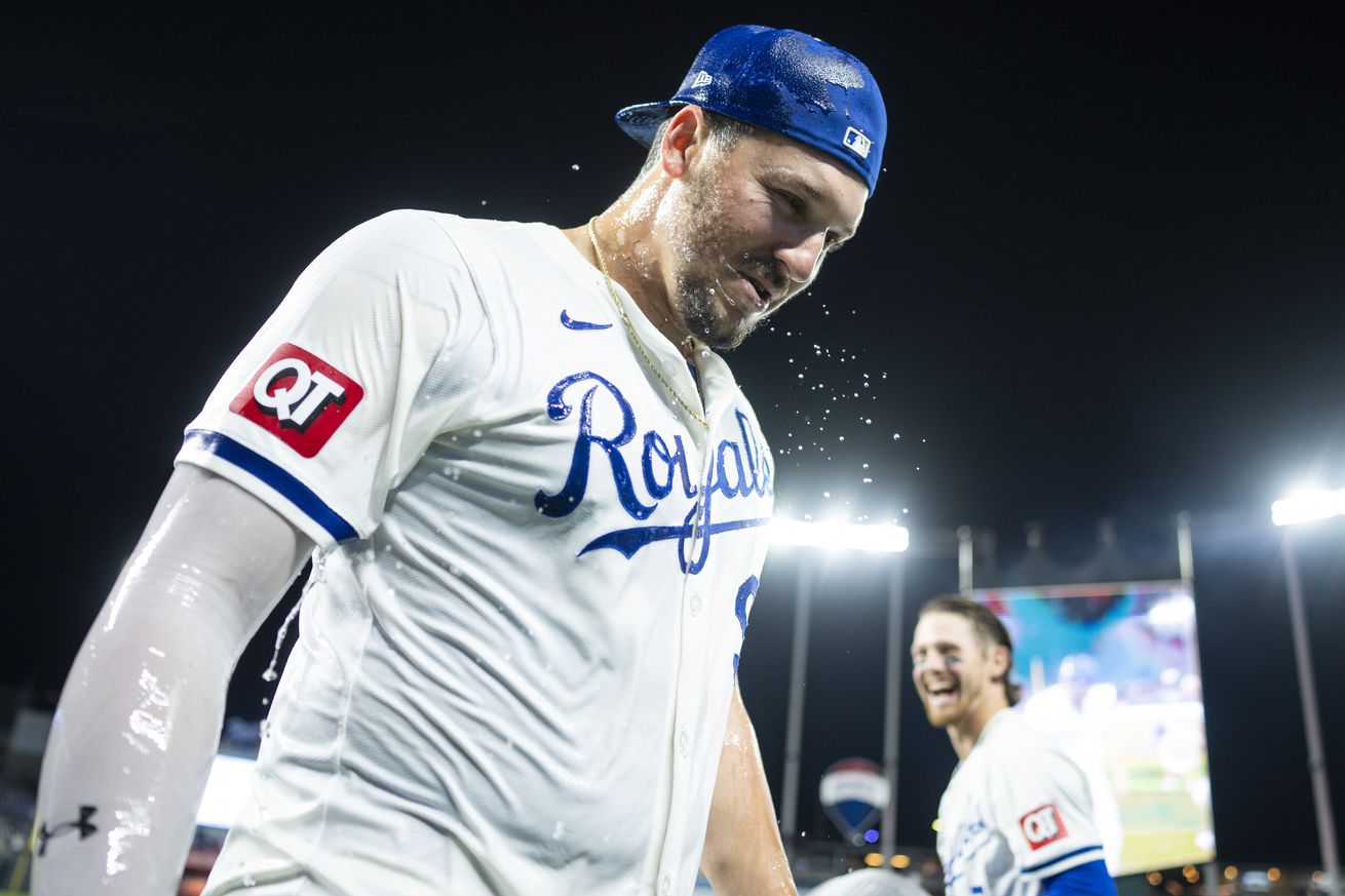 Vinnie Pasquantino #9 of the Kansas City Royals reacts after being doused with water by Bobby Witt Jr. #7 after defeating the Houston Astros at Kauffman Stadium on April 10, 2024 in Kansas City, Missouri.