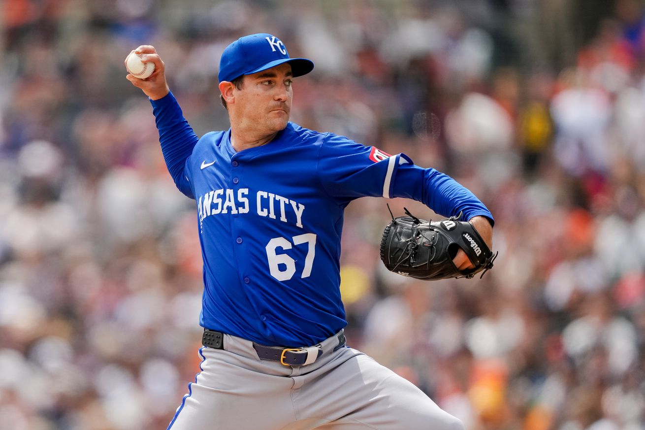 Royals pitcher Seth Lugo brings his arm up before uncorking a pitch.