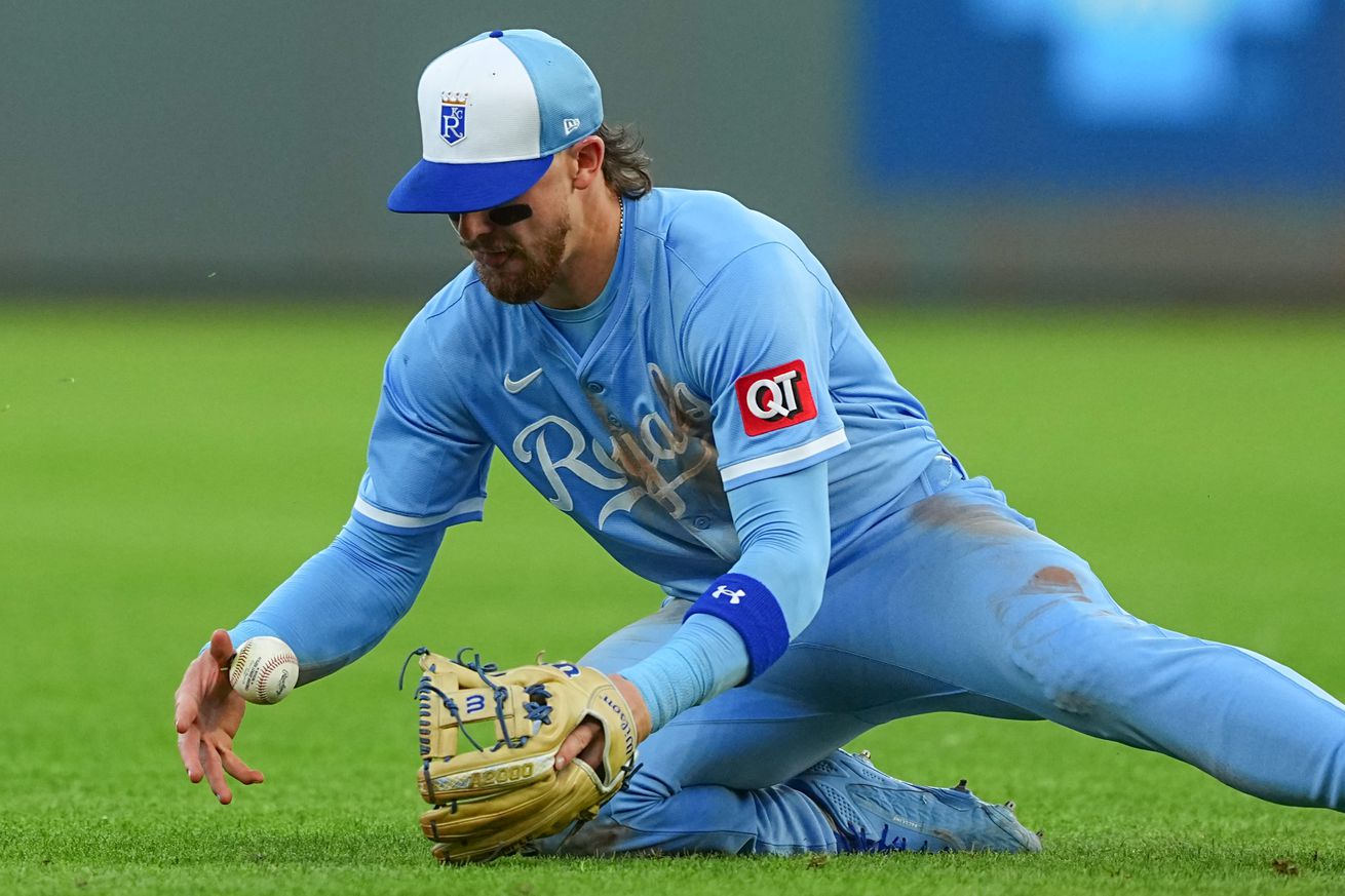 Bobby Witt Jr. #7 of the Kansas City Royals fumbles the baseball