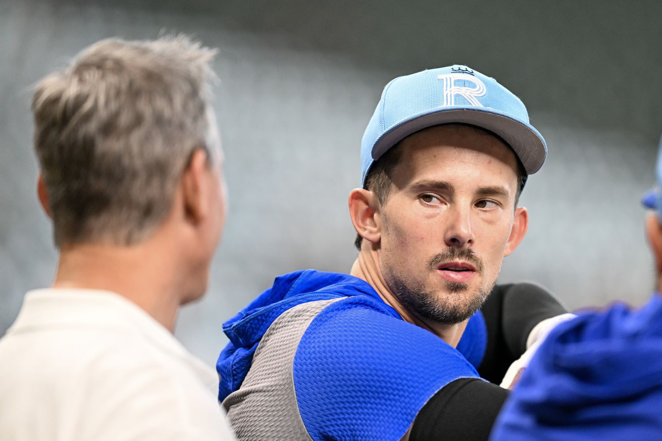 Cavan Biggio #18 of the Kansas City Royals talks with his father Hall of Famer Craig Biggio