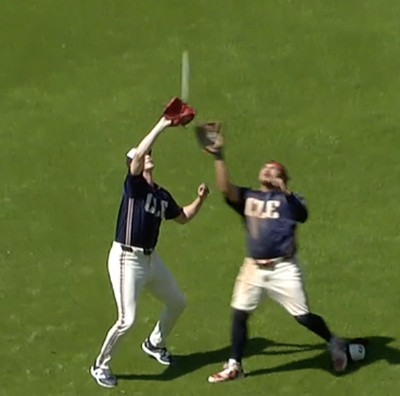 Cleveland first baseman nearly catches a popup that the pitcher was trying to catch. Pitcher ends up catching it.