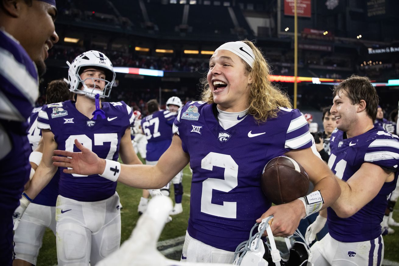 Dec 26, 2024; Phoenix, AZ, USA; Kansas State Wildcats quarterback Avery Johnson (2) celebrates after defeating the Rutgers Scarlet Knights during the Rate Bowl at Chase Field.