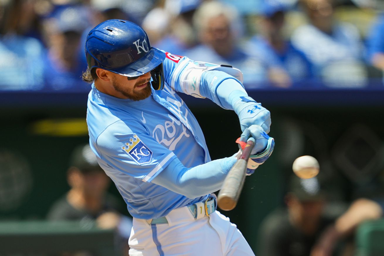 Kansas City Royals shortstop Bobby Witt Jr. (7) hits a single during the third inning against the Chicago White Sox at Kauffman Stadium.