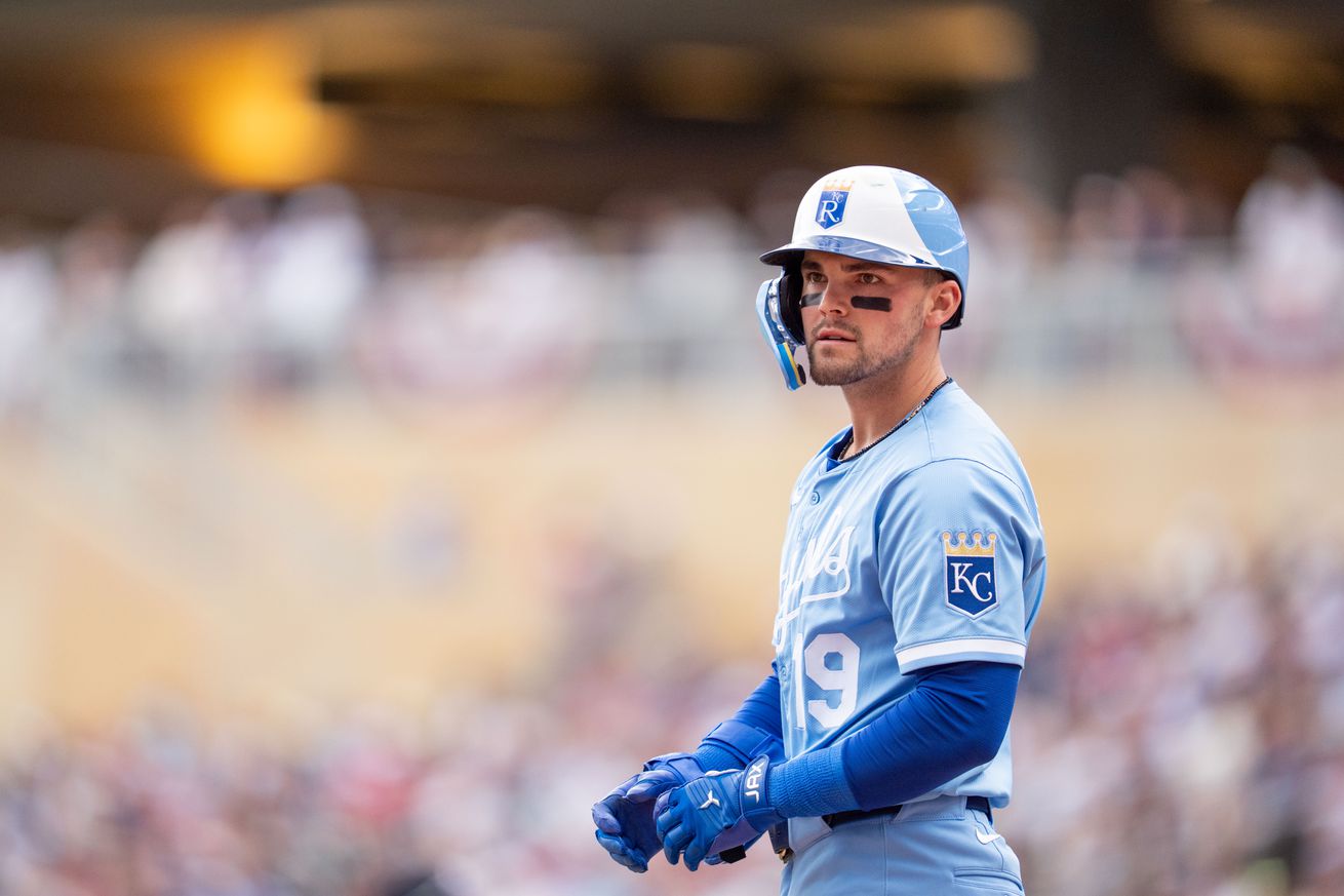 The third base umpire calls Kansas City Royals left fielder Michael Massey (19) out for swinging on a ball pitched by Minnesota Twins starting pitcher Zebby Matthews (52, not shown) in the second inning at Target Field.