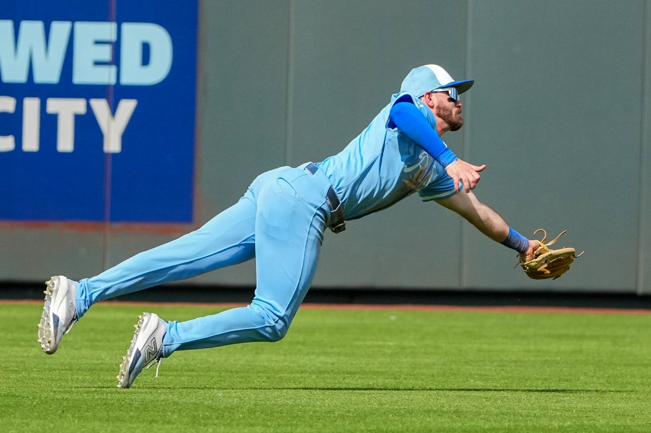 Nick Loftin (12) makes a diving catch against the Detroit Tigers