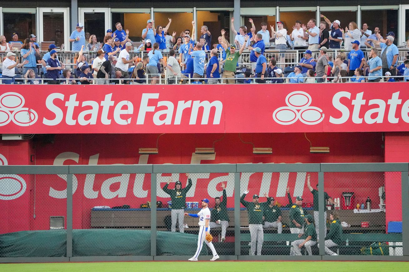 A zoomed out picture showing the left field bullpen in the Royals’ Kauffman Stadium as a home run lands in the stands.