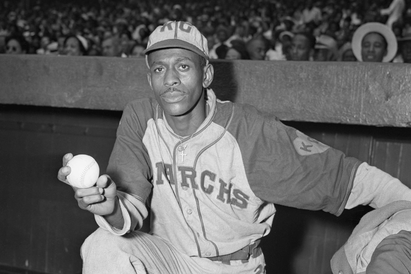Pitcher Satchel Paige Standing in Dugout