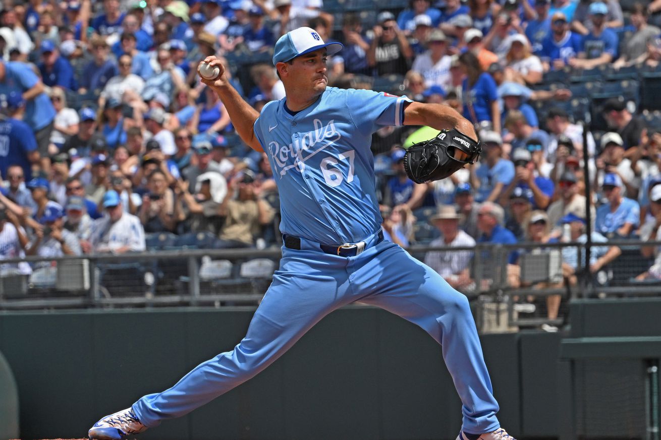 Seth Lugo (67) throws a pitch
