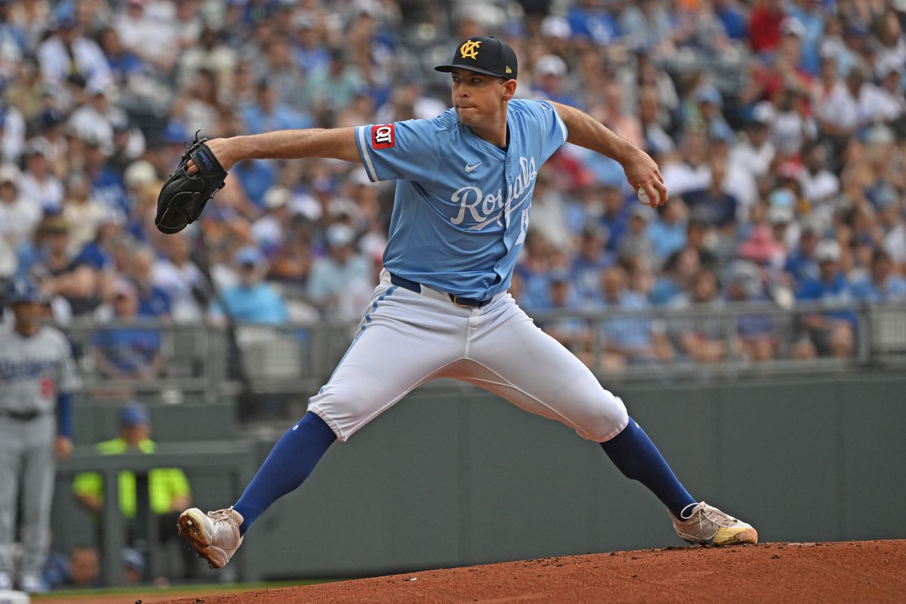 A left-handed pitcher rears back to throw a pitch. Side view. It’s Kris Bubic of the Royals.