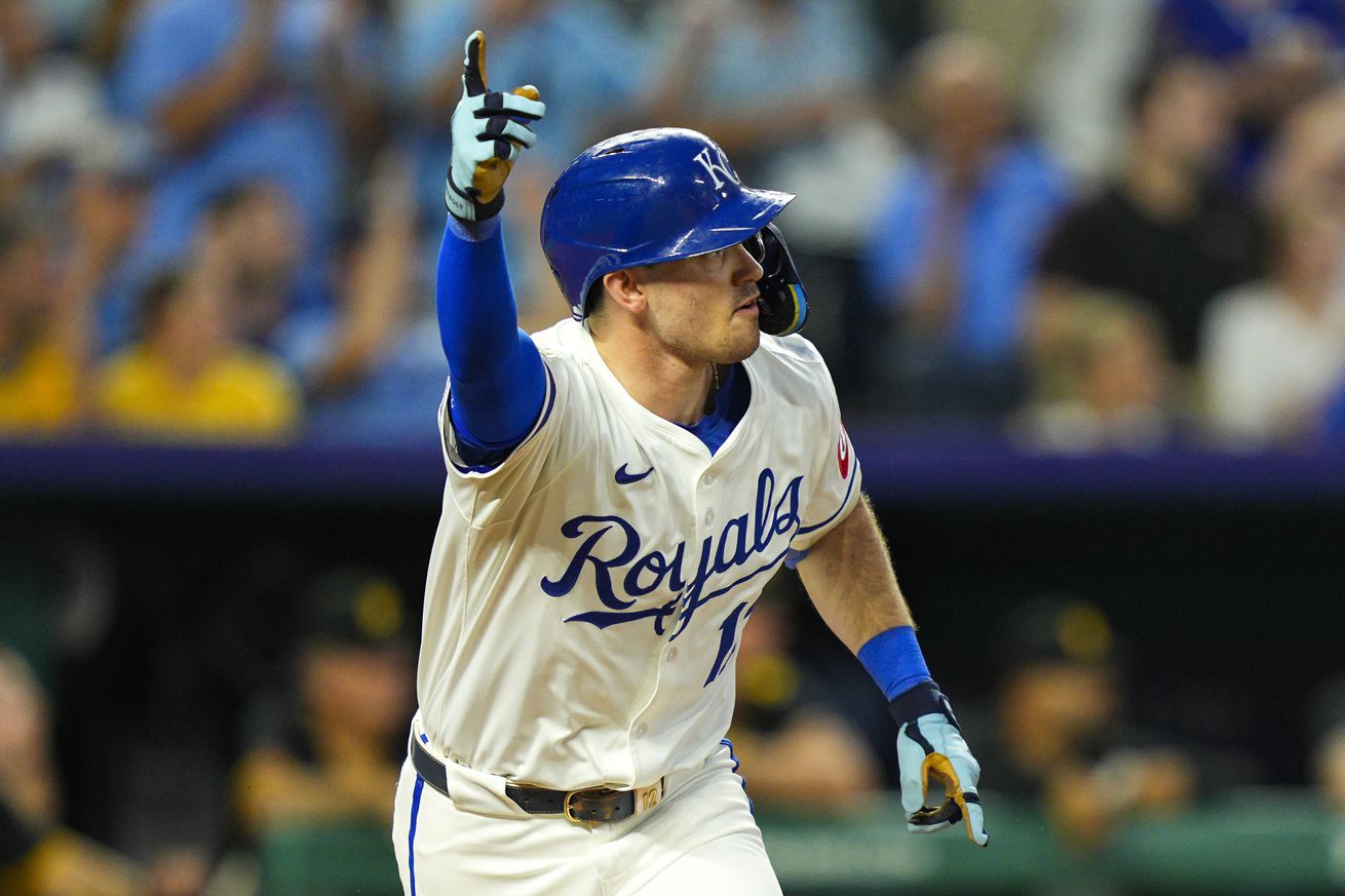 Kansas City Royals second baseman Nick Loftin (12) celebrates after hitting a walk-off single during the ninth inning against the Pittsburgh Pirates at Kauffman Stadium.