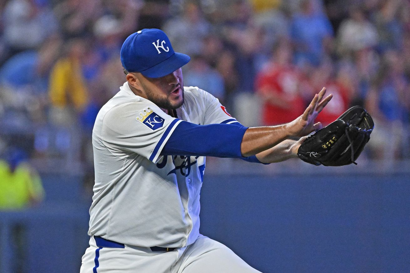 Carlos Estevez (53) reacts after beating the the Pittsburgh Pirates