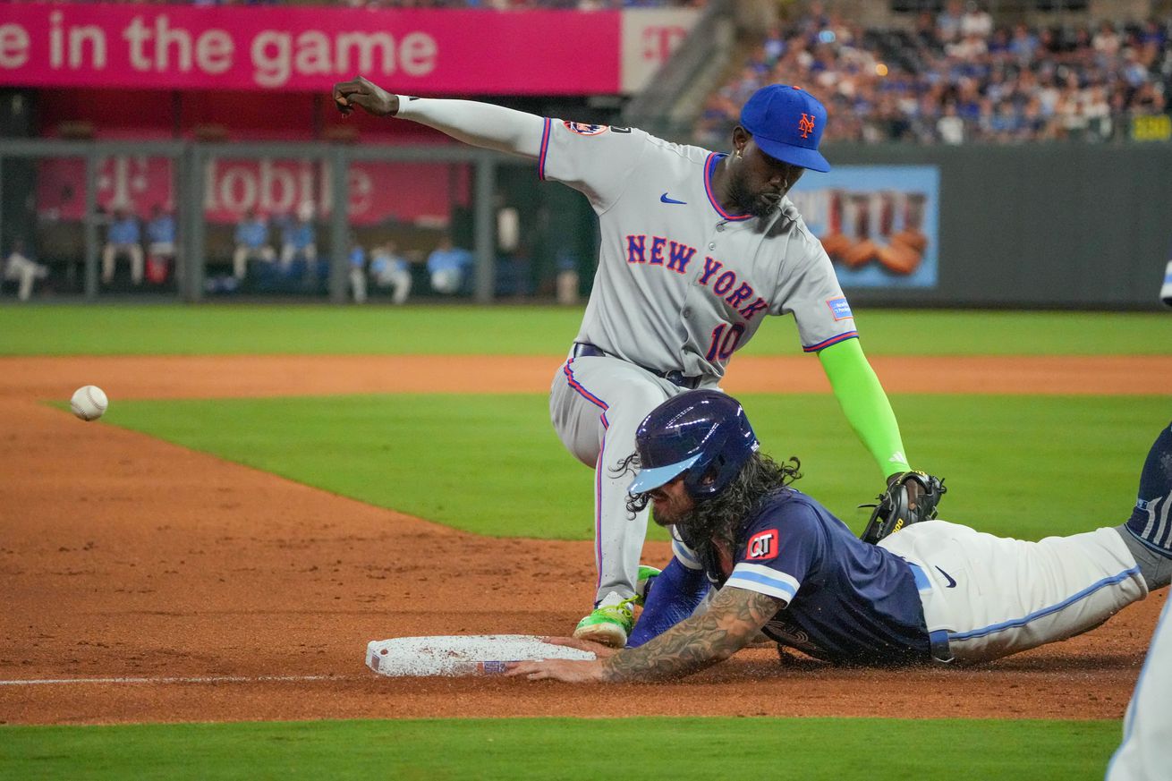 Mets third baseman Ronny Mauricio steps on Jonathan India’s hand as he tries to slide back to third base.